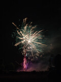 Fototapeta Na sufit - Fireworks above a windmill in the North of France on Bastille day celebration