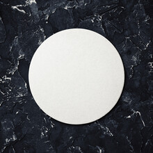 Blank White Beer Coaster On Black Plaster Background. Responsive Design Mockup. Top View. Flat Lay.