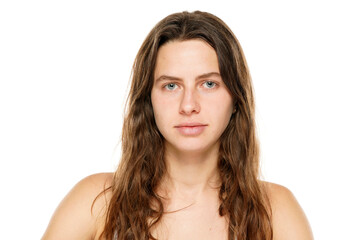 Wall Mural - Portrait of a young woman without makeup on a white background