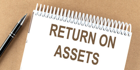 Poster - RETURN ON ASSETS text on a notepad with pen, business concept