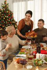 Canvas Print - Happy family enjoying festive dinner at home. Christmas celebration