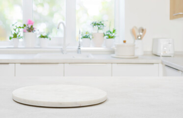 Wall Mural - pedestal for product on wooden table in blurred kitchen interior