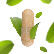 Transparent Herbal Powder Pill. Transparent Pill With Natural Ingredients Powder. Powder Herbal Capsules On White Background. Herbal Pills With Green Leafs Composition.
