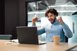 © Prostock-studio - Excited businessman using laptop celebrating success shaking fists screaming yes