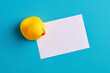 Empty white note paper with a rubber duck toy