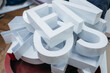 © andrew_shots - Production of metal white 3d letters on different form. Elements of signboard