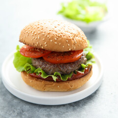 Wall Mural - Traditional homemade burger with fresh tomato