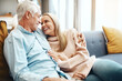 © Camerene P/peopleimages.com - Time with you is the best way to spend time. Cropped shot of an affectionate mature couple relaxing on the sofa at home.