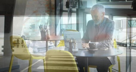 Poster - Animation of senior caucasian businessman using laptop in office