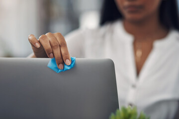 Poster - Be sure to disinfect the items you regularly use. Closeup shot of an unrecognisable businesswoman cleaning a laptop in an office.
