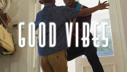 Canvas Print - Animation of good vibes text over african american father greeting his son