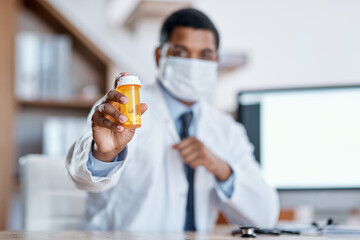 Wall Mural - this will cure your condition. closeup shot of an unrecognisable doctor holding a bottle of pills in