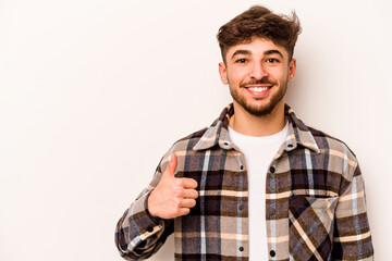 Wall Mural - Young hispanic man isolated on white background smiling and raising thumb up