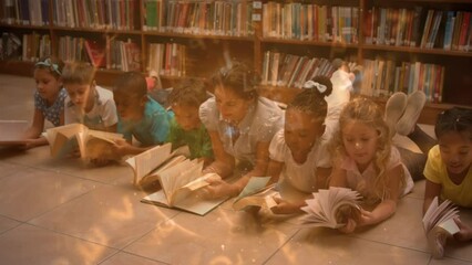 Poster - Animation of letters spinning over teacher and happy school children lying on floor with books