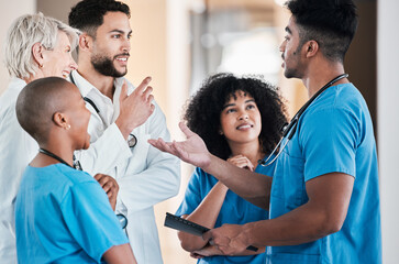 Poster - The minds to solve any medical mystery. Shot of a group of young doctors having a discussion in a modern office.