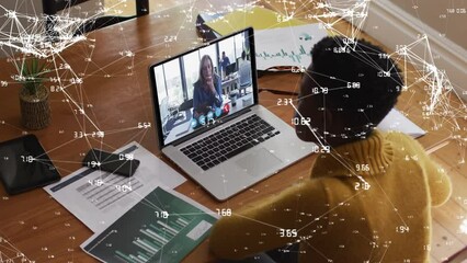 Canvas Print - Network of connections against african american woman having a videocall on laptop working from home