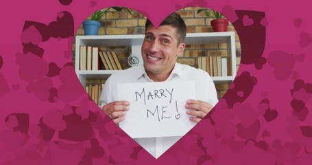 Poster - Animation of heart shaped frame with pink hearts over caucasian man proposing on video call