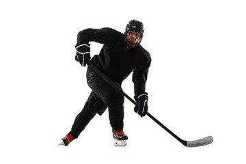 Portrait of professional male hockey player training isolated over white background. Match, competition preparation.