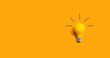 Leinwandbild Motiv Yellow light bulb - flat lay from above