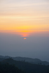 Canvas Print - silhouette and panorama layer of mountain with sunset background
