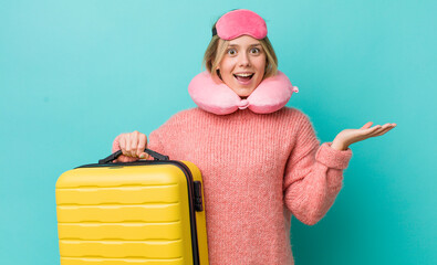 Wall Mural - pretty blonde woman feeling happy and astonished at something unbelievable. flight passenger concept