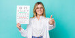 © kues1 - pretty blonde woman feeling proud,smiling positively with thumbs up. optical vision test concept