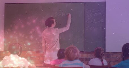Poster - Animation of light spots over caucasian female teacher writing on board with diverse schoolchildren