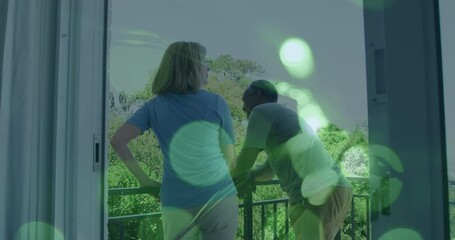 Poster - Animation of light spots over senior diverse couple