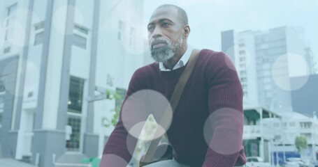 Poster - Animation of light spots over african american man cycling