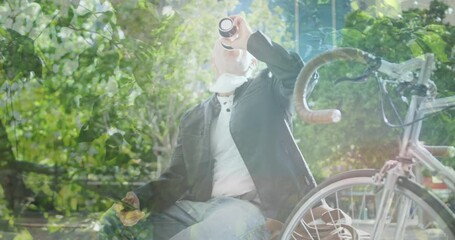 Poster - Animation of leaves over caucasian man drinking takeaway coffee