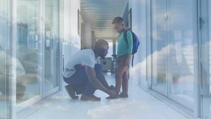 Poster - Animation of lights over happy african american father tying shoe to son