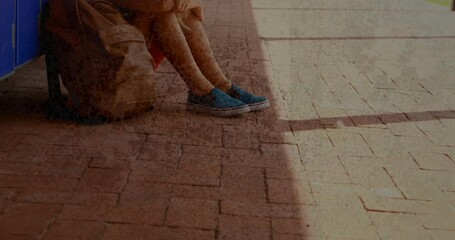 Poster - animation of moving background over sad caucasian schoolboy at school