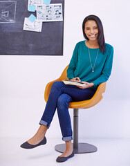 Poster - I take my sketchpad everywhere. Portrait of an attractive young illustrator sitting in front of drawings.