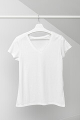 Wall Mural - Group of Assorted t-shirts hanging on white hangers. Clothing rack