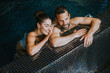 © BGStock72 - Young couple relaxing in a swimming pool
