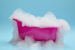Toy bathtub overflowing with foam on light blue background