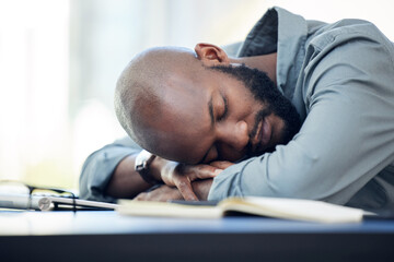 Poster - I need a five minute nap. Shot of a handsome young businessman sleeping on his desk in the office.