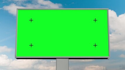 Wall Mural - Blank green billboard or large display and moving white clouds against blue sky - front view, zoom in shot, timelapse. Consumerism, time lapse, green screen, template, copy space, chroma key concept