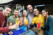 © Xavier Lorenzo - Group portrait of multiracial young people cheering and toasting with trendy cocktails - United diverse friends having fun drinking alcohol on summer vacation - Focus on asian woman face