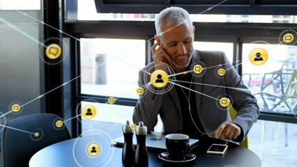 Poster - Animation of network of connections with people icons over caucasian businessman using smartphone