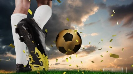 Poster - Animation of confetti over feet of caucasian soccer player and gold ball at sunset