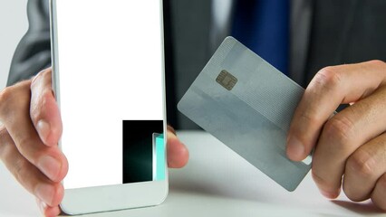 Poster - Video of caucasian man holding tablet and credit card