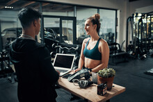 Id Like To Sign Up For Premium Membership Please. Cropped Shot Of An Attractive Young Sportswoman Talking To A Male Fitness Instructor At The Reception Of A Gym.