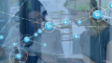 Poster - Animation of network of connections with icons over diverse business people using tablet
