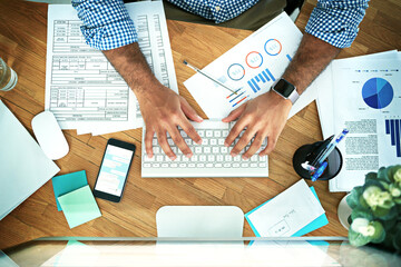 Poster - His hands are magic on a keyboard. High angle shot of an unrecognizable businessman working in his office.