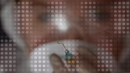 Poster - Animation of light spots over syringe and caucasian male scientist