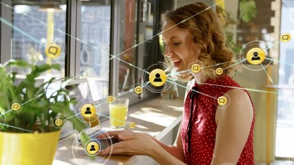 Poster - Animation of network of connections with icons over caucasian businesswoman using smartphone