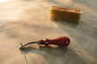 © Wavebreak Media - Close-up of tool and brush on leather in workshop