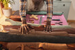 © Wavebreak Media - Midsection of african american young man holding leather rolls on table in workshop