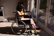 © Wavebreak Media - Depressed african american disabled woman sitting on wheelchair with hands on her face at home